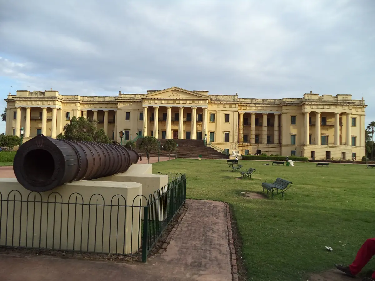A cannon on the lawn in front of the palace